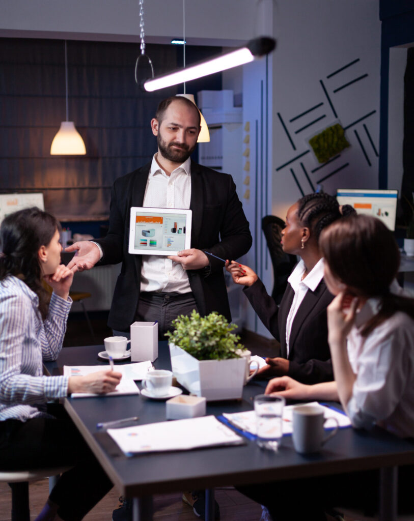 business entrepreneur man presenting company statistics using tablet for financial presentation